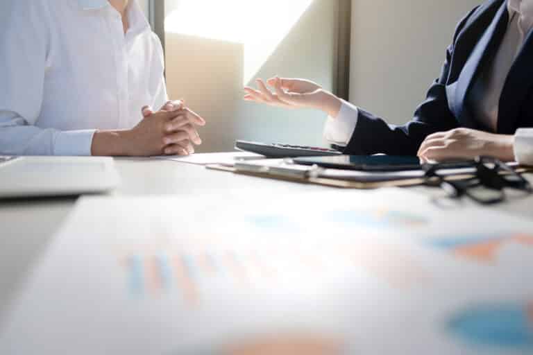 Business colleagues meeting about invest performance at a modern