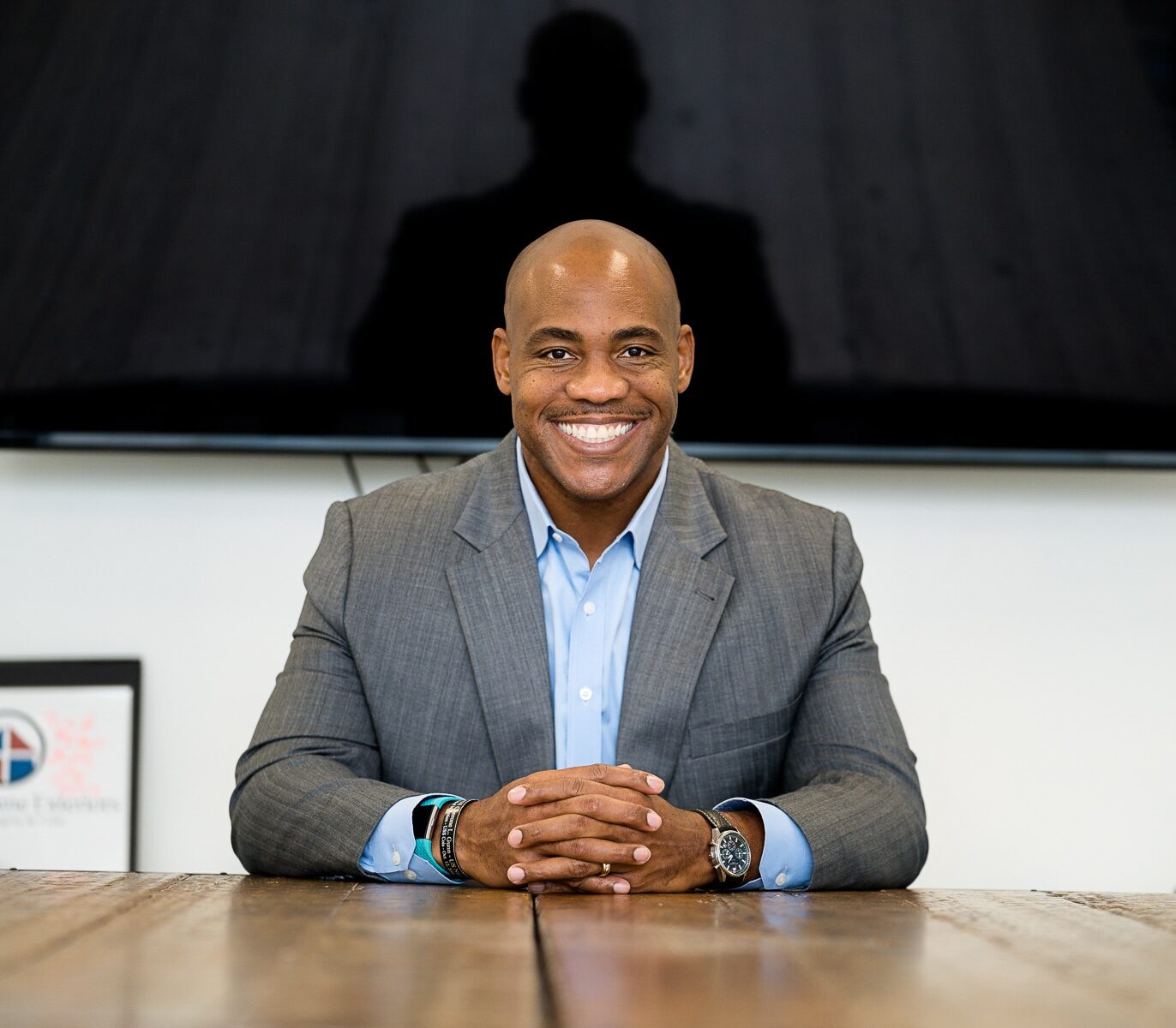 Anton Gunn sitting down with hands together
